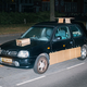 Illustration for article titled This Artist Turns Boring Rides Into Supercars At Night Using Cardboard